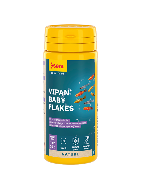 Fish food flakes close-up for aquarium feeding guide